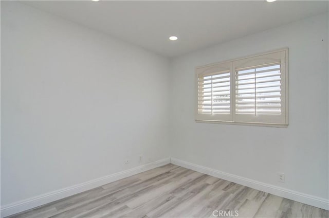 empty room with light wood-type flooring