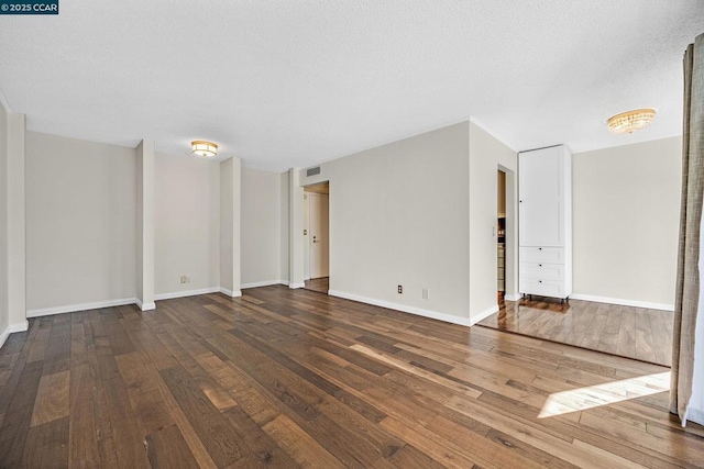 unfurnished room featuring hardwood / wood-style flooring