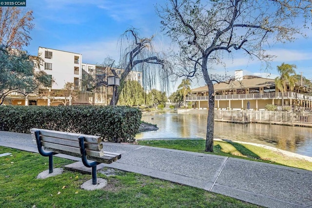 view of community with a water view