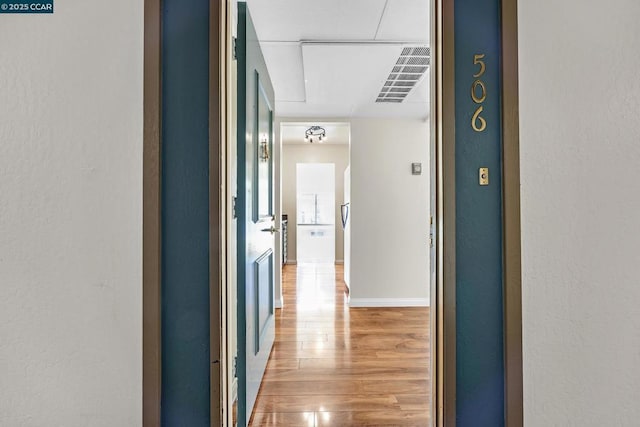 corridor featuring hardwood / wood-style floors