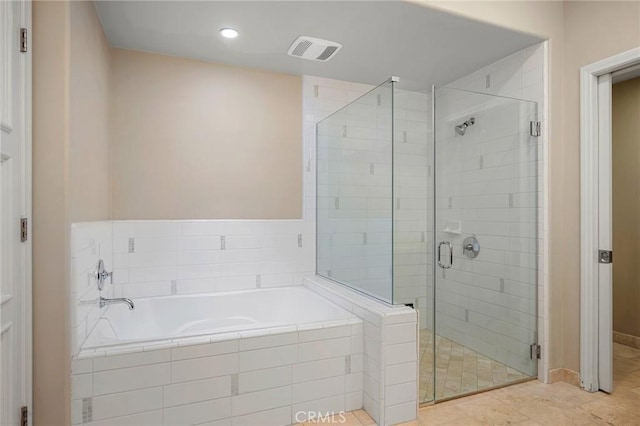 bathroom featuring shower with separate bathtub and tile patterned flooring