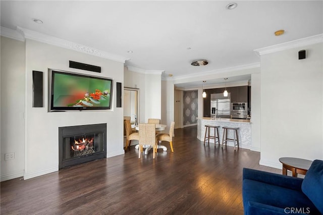 living room with ornamental molding and dark hardwood / wood-style flooring