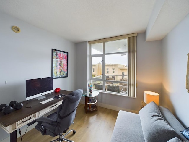 office space with wood-type flooring