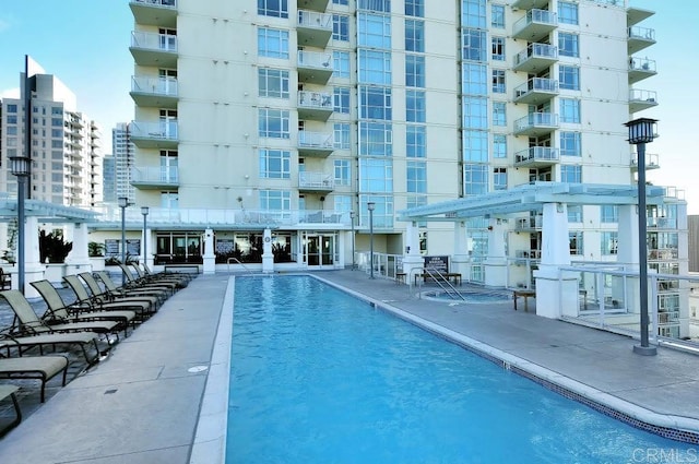 view of swimming pool with a pergola