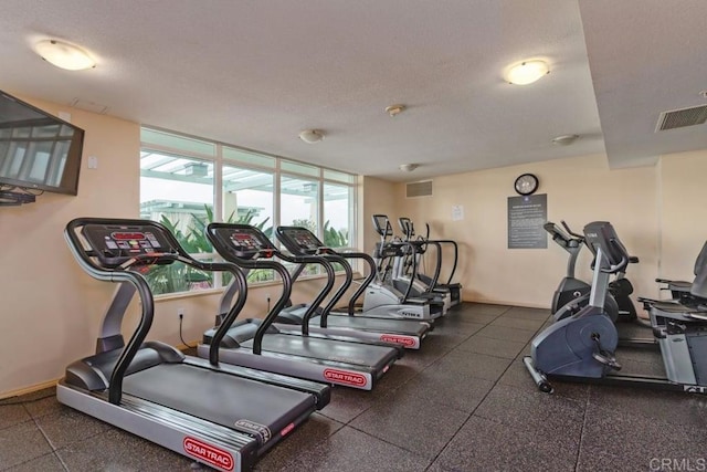 workout area featuring a textured ceiling