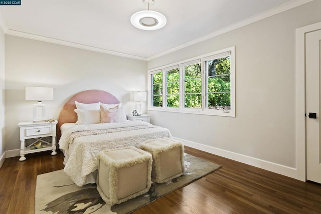 bedroom with crown molding and dark hardwood / wood-style flooring