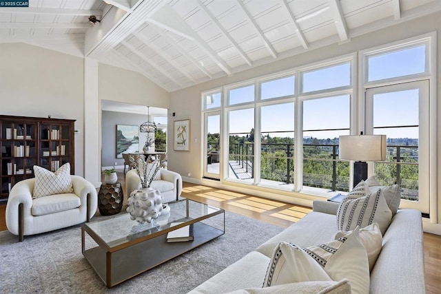 living room featuring beam ceiling, high vaulted ceiling, and light wood-type flooring