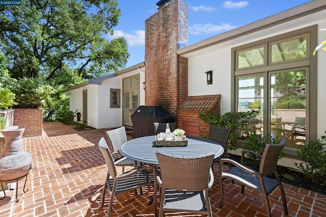 view of patio / terrace with a grill and french doors