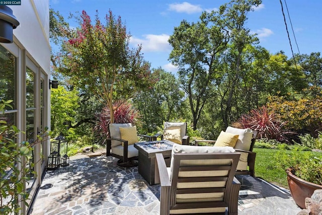 view of patio / terrace featuring an outdoor fire pit