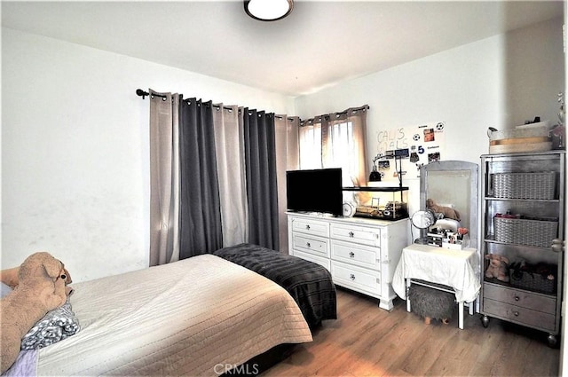 bedroom featuring dark hardwood / wood-style flooring