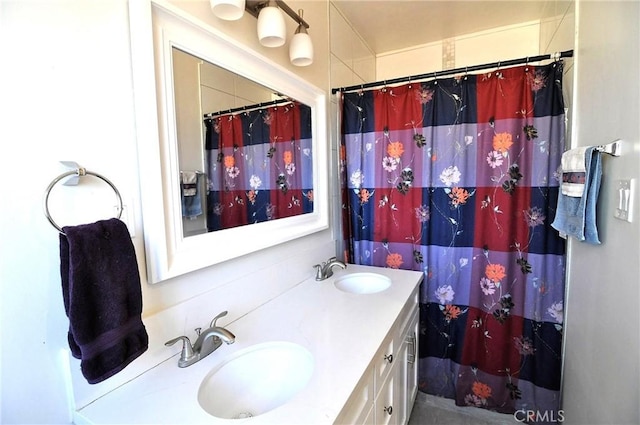 bathroom featuring vanity and a shower with curtain