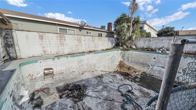 exterior details featuring a pool