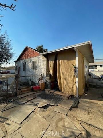 back of house with a patio