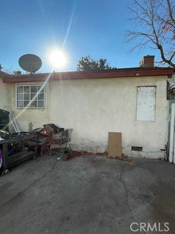 view of side of home featuring a patio