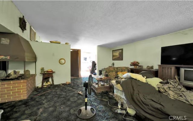 carpeted living room featuring a textured ceiling