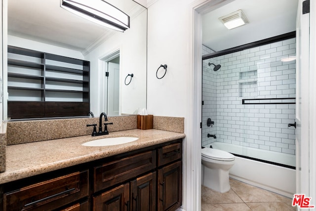 full bathroom featuring tile patterned floors, toilet, combined bath / shower with glass door, crown molding, and vanity