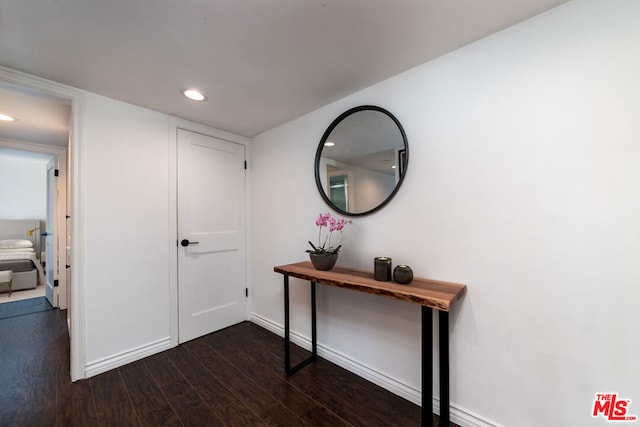 hallway featuring dark hardwood / wood-style flooring