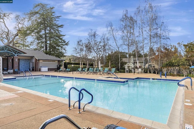 view of swimming pool with a patio