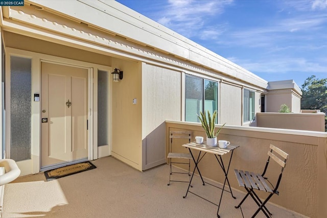 entrance to property with a balcony