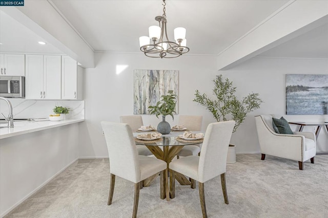 carpeted dining space featuring ornamental molding and a chandelier