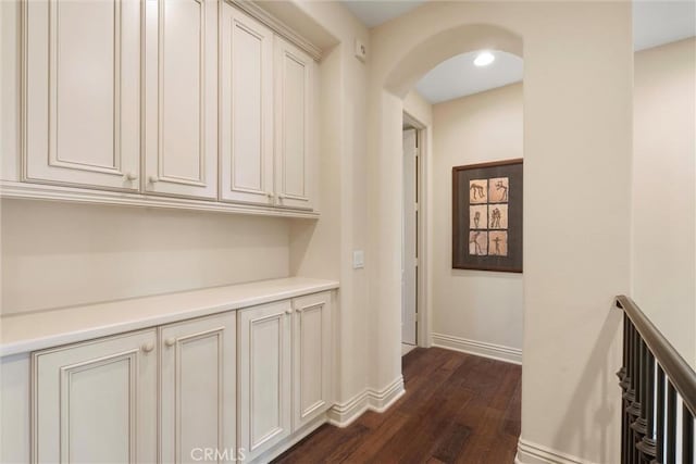 37 Triple Leaf, Irvine, CA 92620 - hallway featuring dark wood finished floors, arched walkways, and baseboards