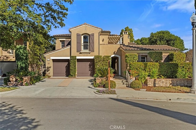 37 Triple Leaf, Irvine, CA 92620 - mediterranean / spanish house featuring stucco siding, driveway, an attached garage, and a tile roof