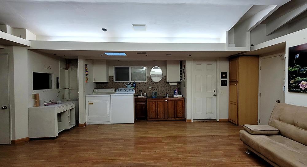 interior space featuring hardwood / wood-style flooring and washer and clothes dryer