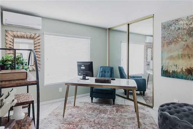 office space featuring light tile patterned floors and an AC wall unit