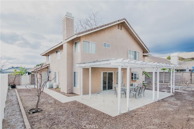 rear view of house with a pergola