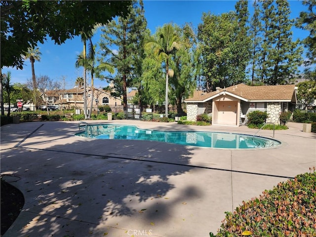 view of swimming pool featuring a patio