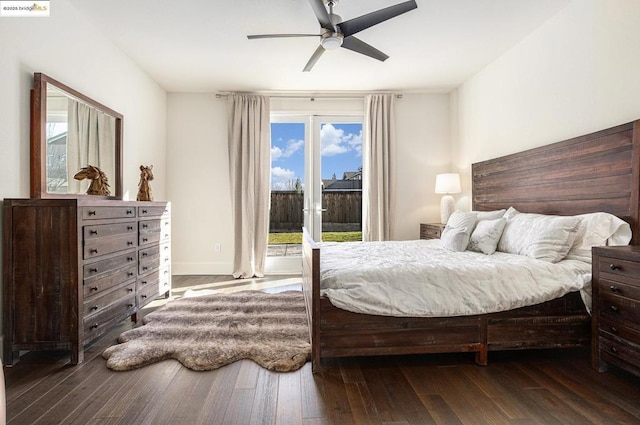 bedroom featuring dark hardwood / wood-style flooring, access to outside, and ceiling fan