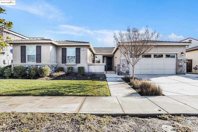 ranch-style home with a garage and a front lawn