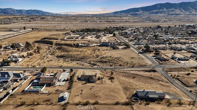 birds eye view of property featuring a mountain view