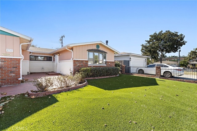 single story home with a garage and a front lawn