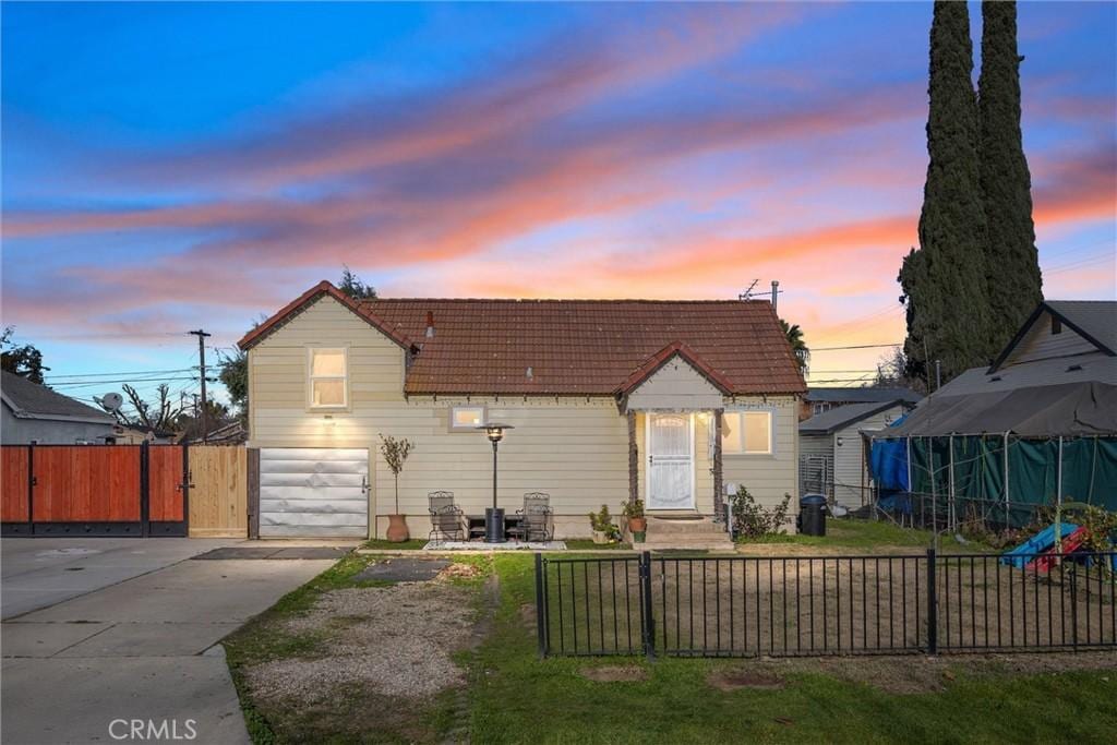 bungalow-style home featuring a garage