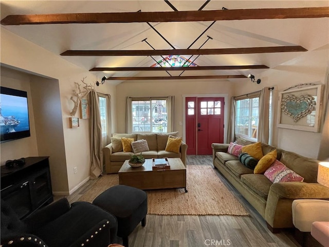 living room featuring hardwood / wood-style floors and lofted ceiling with beams