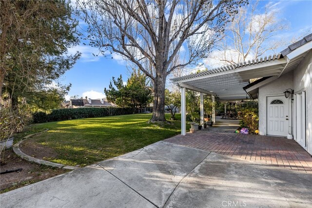 view of yard featuring a pergola and a patio