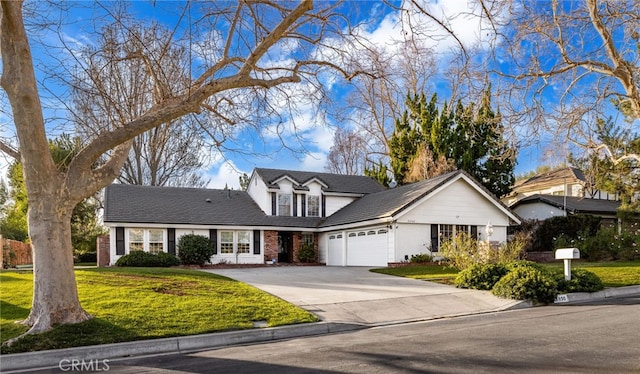 view of front of house with a garage and a front yard