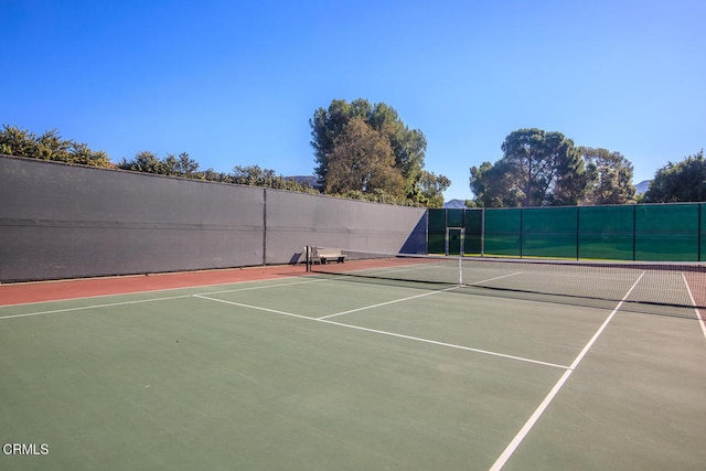 view of sport court with basketball hoop