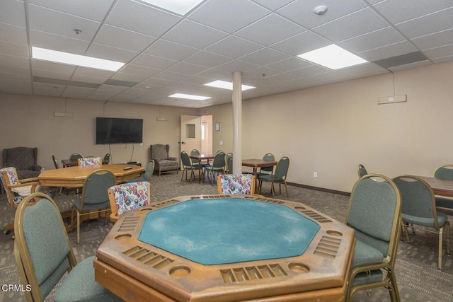 interior space featuring carpet floors and a drop ceiling