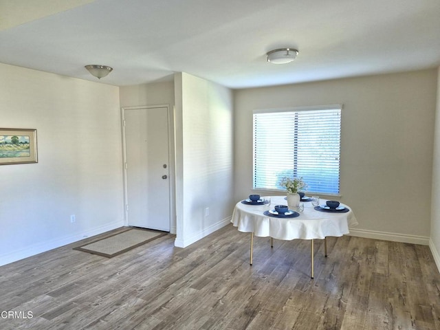 unfurnished dining area featuring hardwood / wood-style flooring