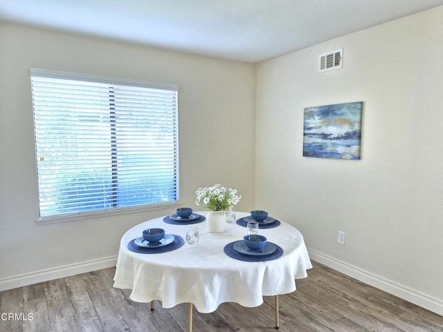 dining area with wood-type flooring