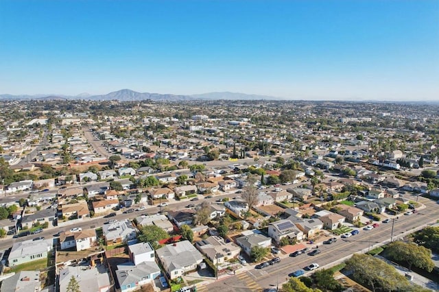 birds eye view of property featuring a mountain view