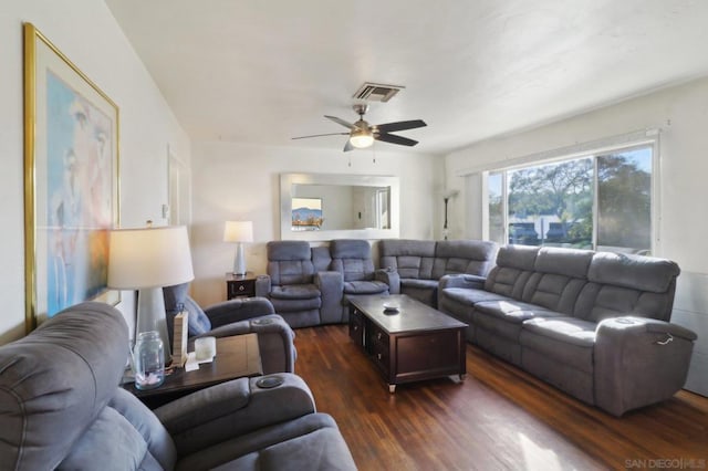 living room featuring dark hardwood / wood-style floors and ceiling fan