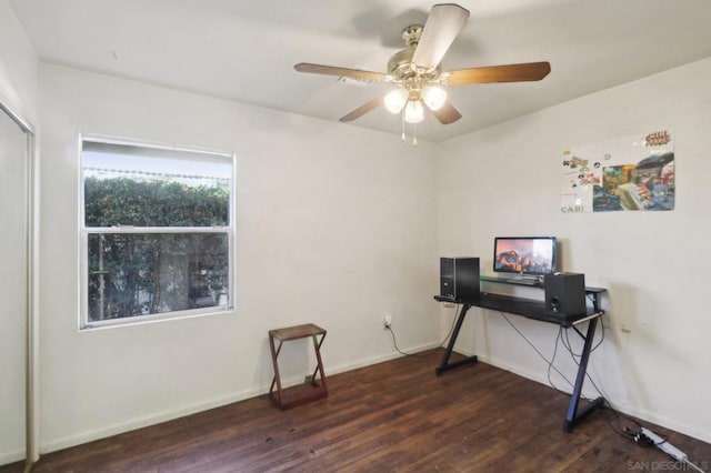 office space featuring ceiling fan and dark hardwood / wood-style flooring