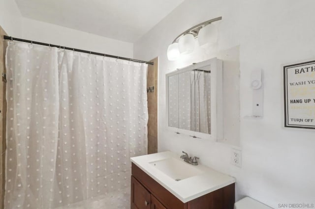 bathroom with vanity and curtained shower