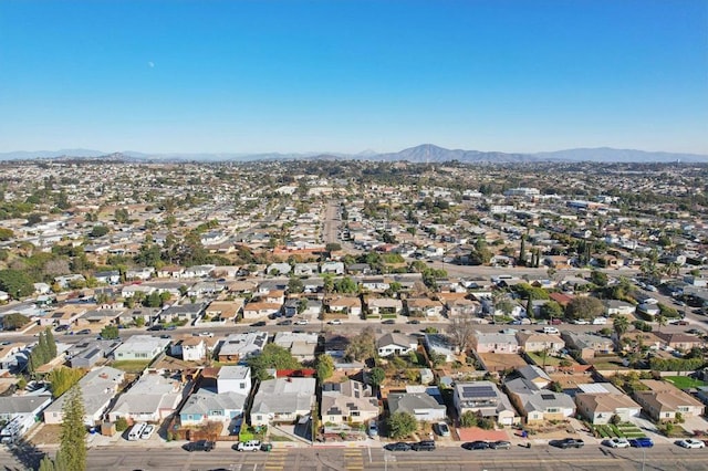 birds eye view of property featuring a mountain view