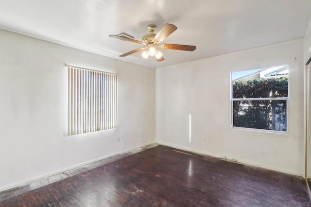 unfurnished room featuring ceiling fan and dark hardwood / wood-style floors