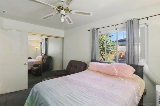 bedroom with ceiling fan and a closet