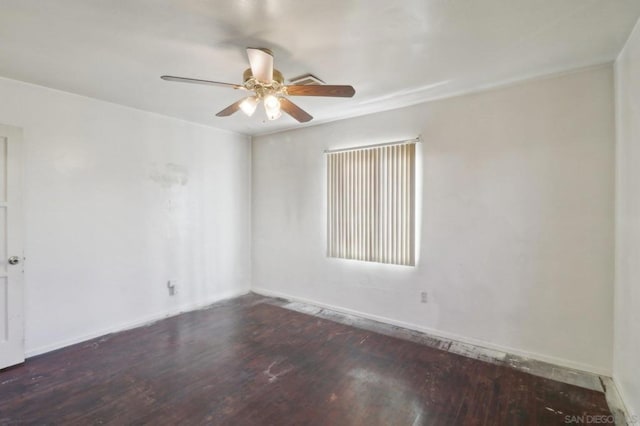 unfurnished room featuring dark wood-type flooring and ceiling fan